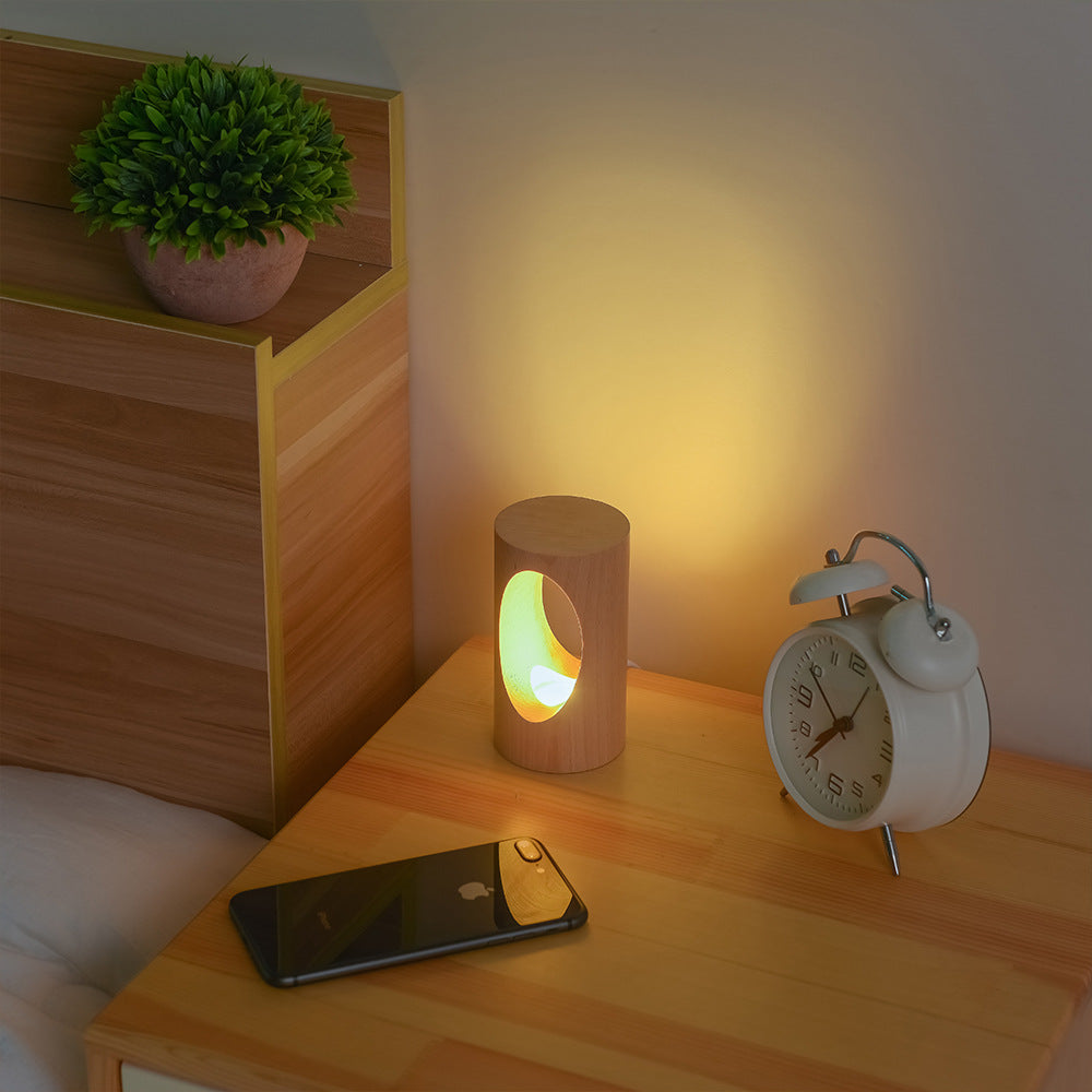 Solid Wood Hollow LED Table Lamp – Sculptural Warm Glow Light, night lights, front view, with calming Nordic simplicity