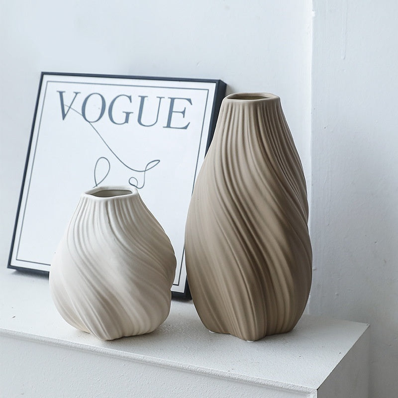 Swirl Carved Ceramic Vase | Japandi Twisted Form, vases & vessels, in a styled setting, in soft neutral organic tones